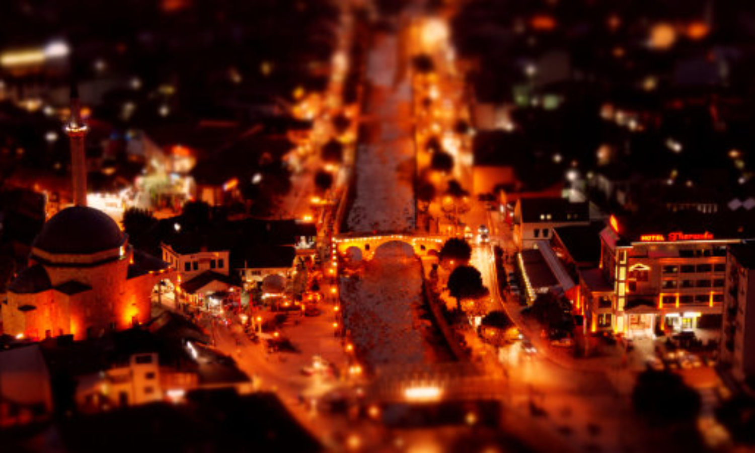 Aerial night view of Prisren, Kosovo in tilt-shift video