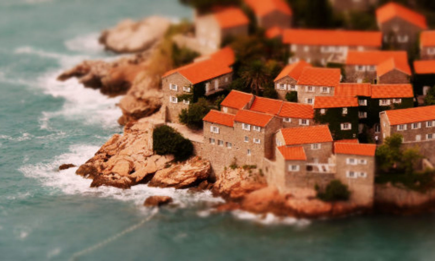 Aerial view of Sveti Stefan in Montenegro in tilt-shift video