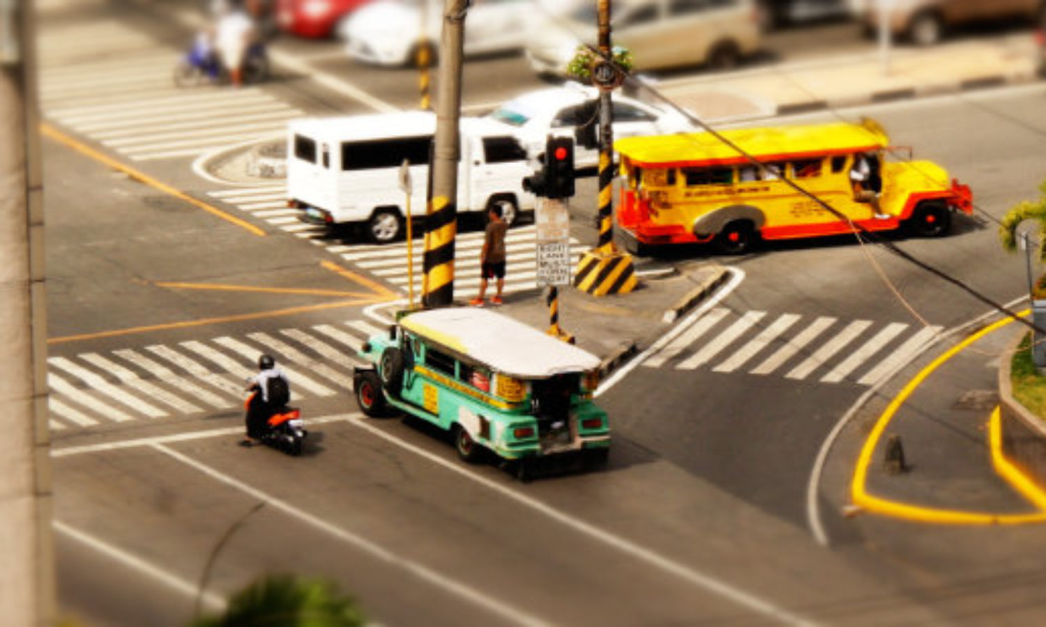 Street scene wth Jeepneys in Manila in the Philippines in tilt-shift video
