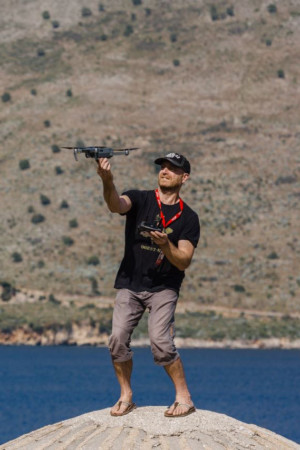 Joerg Daiber is catching a drone while shooting for Little Big World in Albania while shooting a Little Big World time lapse video.